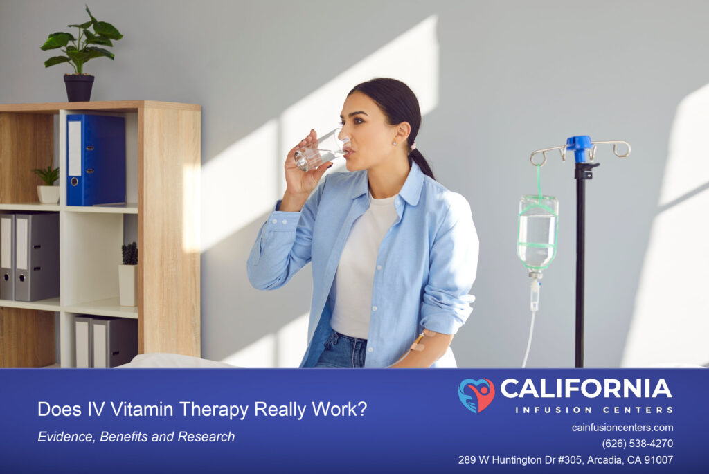 A picture of a woman receiving IV drip therapy while drinking a cup of water.