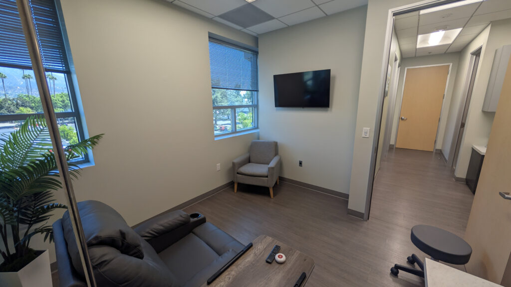 Private IV therapy treatment room at California Infusion Centers in Arcadia with reclining chair, natural light and comfortable wellness setting for IV hydration and antioxidant therapy.