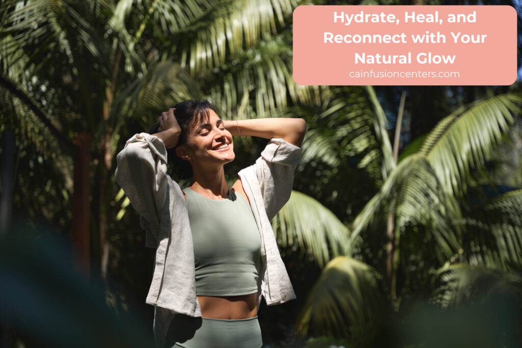 Smiling woman standing in sunlight among palm trees, representing the energy and wellness benefits of anti-aging IV therapy in Los Angeles.