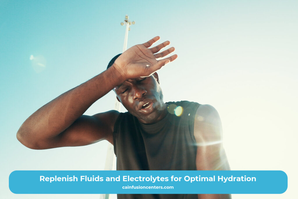 Athlete wiping sweat in the sunlight after exercise, symbolizing electrolyte and hydration replenishment through IV therapy.