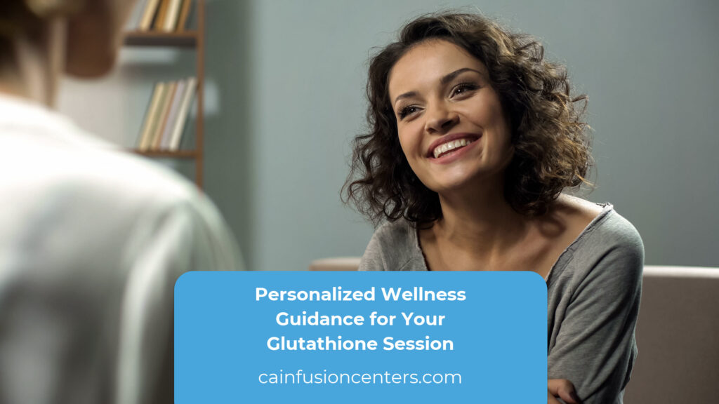 Smiling client speaking with a clinician during a wellness intake before a glutathione injection.