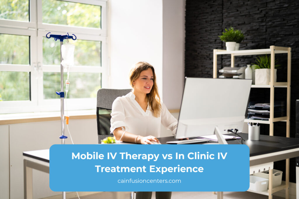 Patient receiving IV therapy while working at a desk, illustrating the difference between mobile IV therapy convenience and traditional in clinic IV treatment settings.
